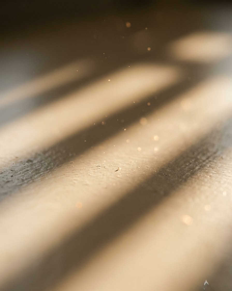 Amber afternoon light falling through blinds